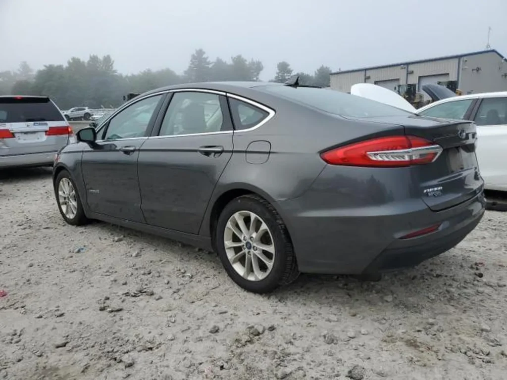 2019 Ford Fusion Hybrid SE szary - prawy tył, profil boczny.