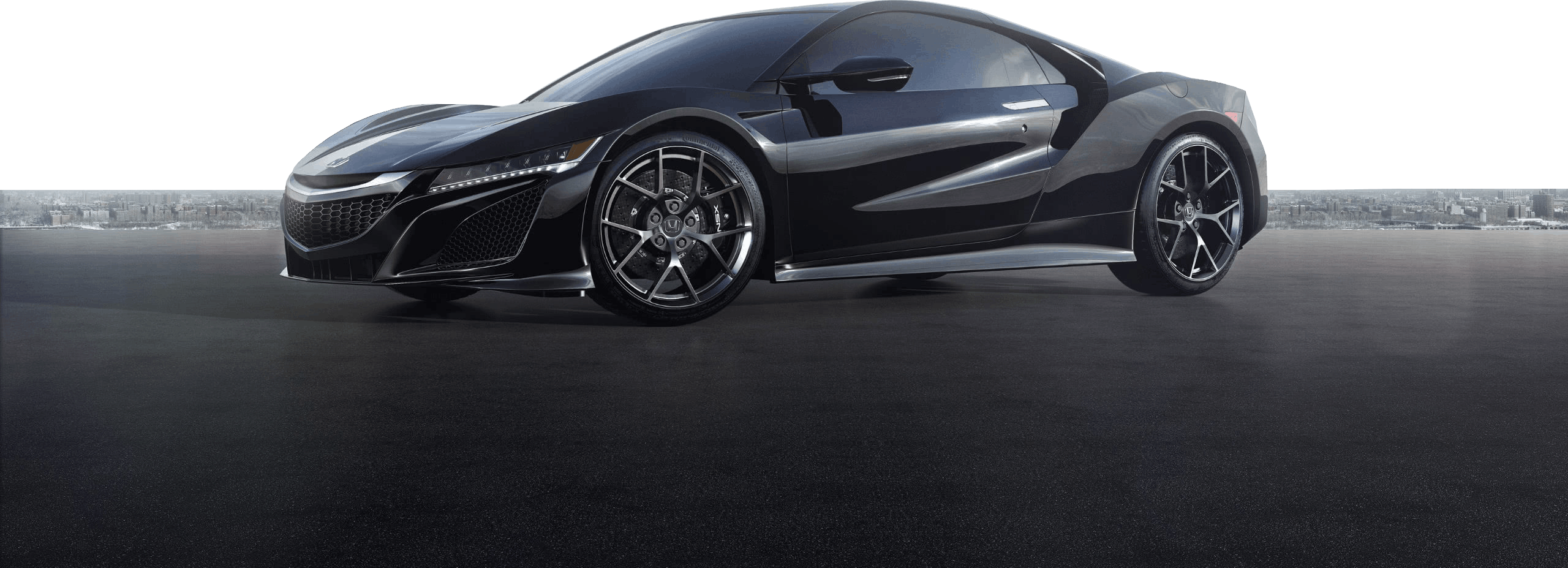 Czarne coupe Honda NSX na ciemnym tle, widok z boku